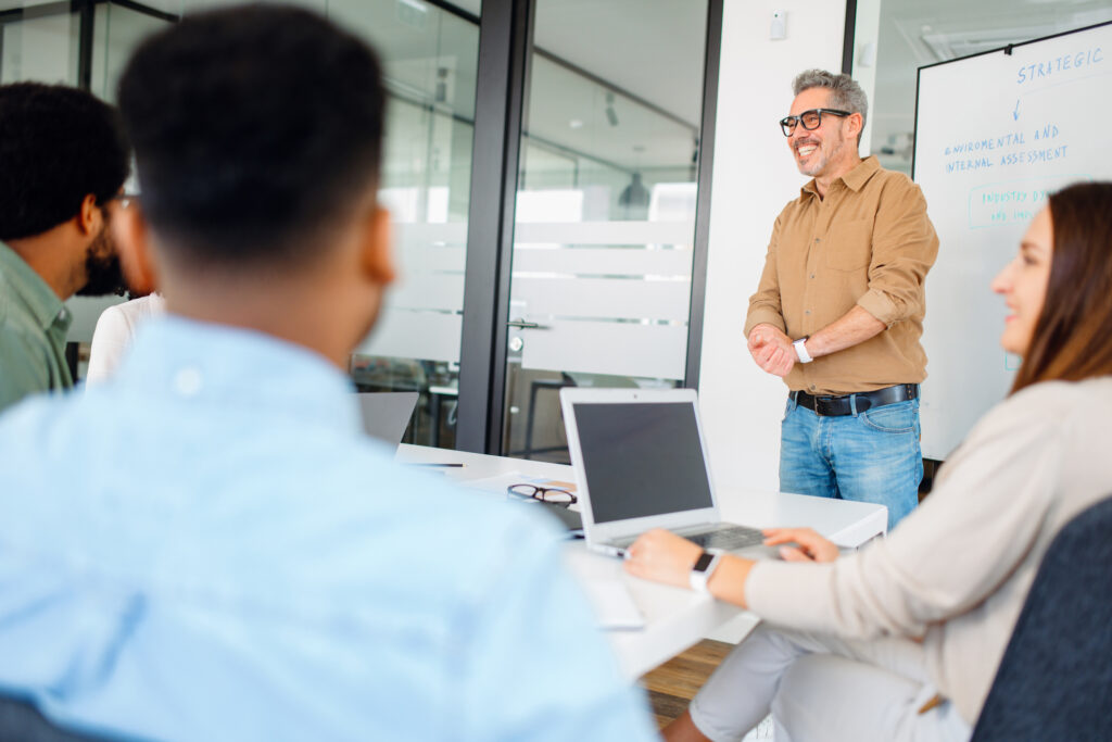 Colleagues engage in a lively exchange of ideas in an office