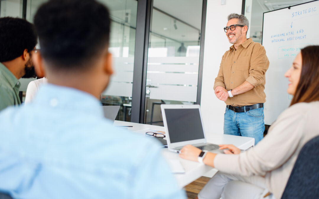 Colleagues engage in a lively exchange of ideas in an office