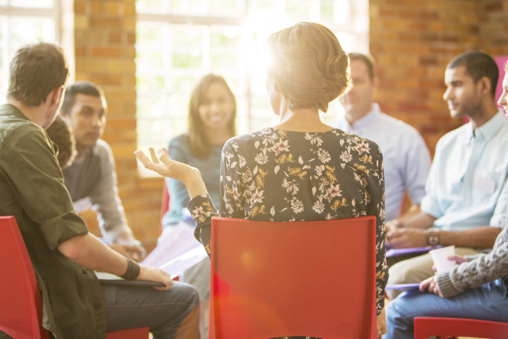 Woman speaking in group therapy session