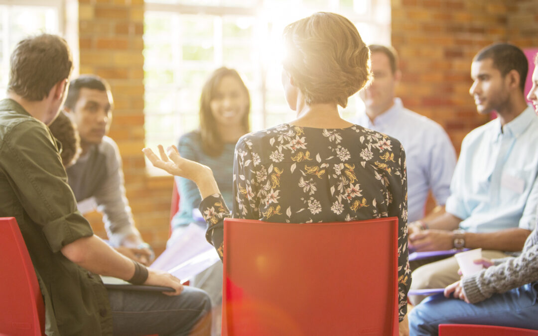 Woman speaking in group therapy session